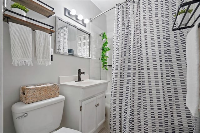 bathroom featuring shower / bath combination with curtain, toilet, and vanity