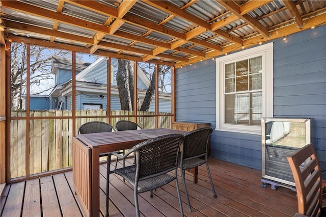 wooden terrace with outdoor dining space