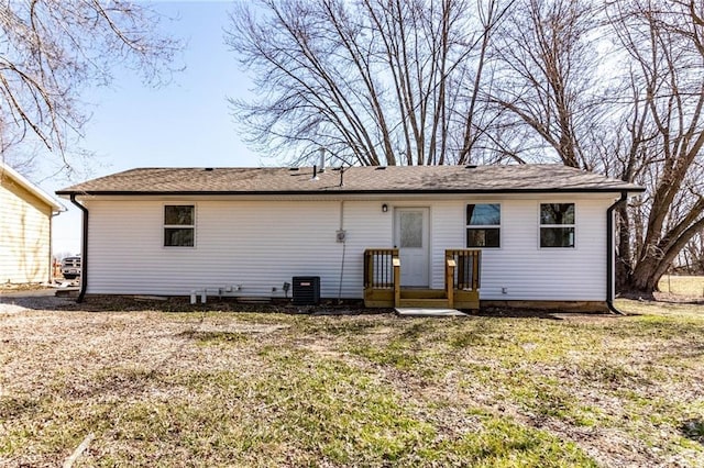 back of property featuring central air condition unit