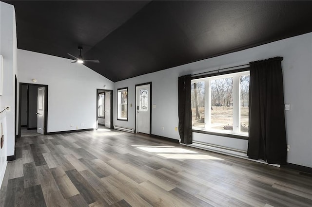 spare room featuring ceiling fan, baseboards, lofted ceiling, and wood finished floors