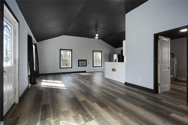 unfurnished living room featuring a ceiling fan, lofted ceiling, baseboards, and dark wood-style flooring