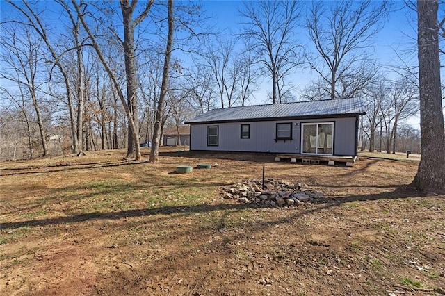 back of property with metal roof