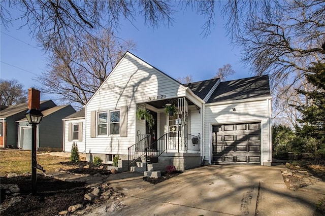 view of front of home featuring a garage and concrete driveway