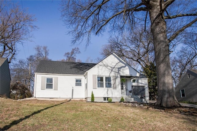 bungalow-style house with a front yard