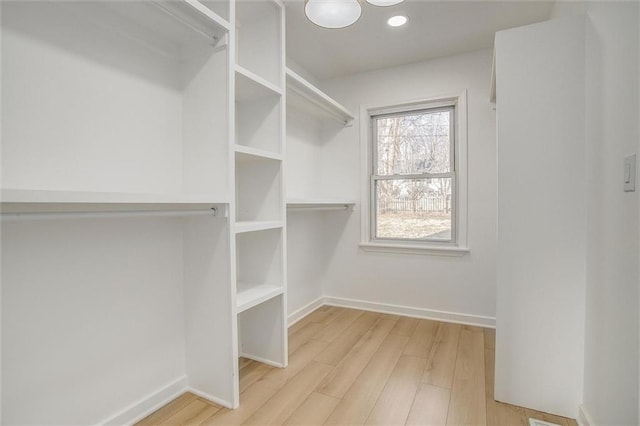 walk in closet featuring light wood-style floors