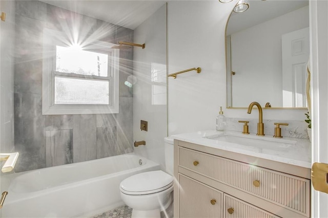 bathroom with tub / shower combination, toilet, and vanity