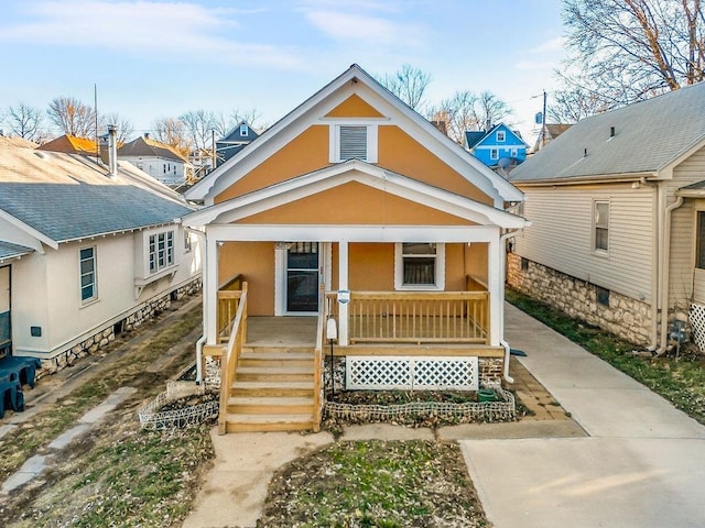 view of front of property with a porch and stucco siding