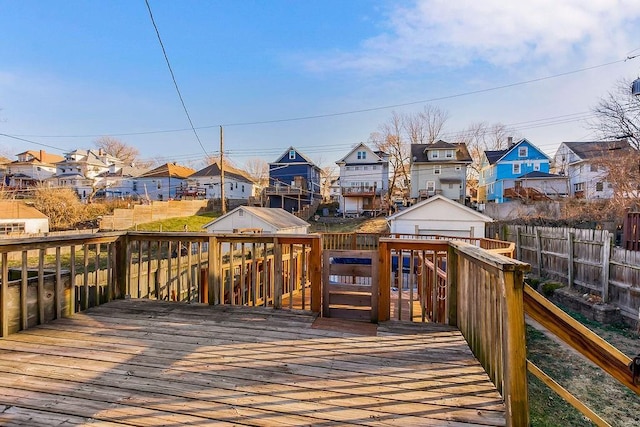 wooden deck featuring fence and a residential view