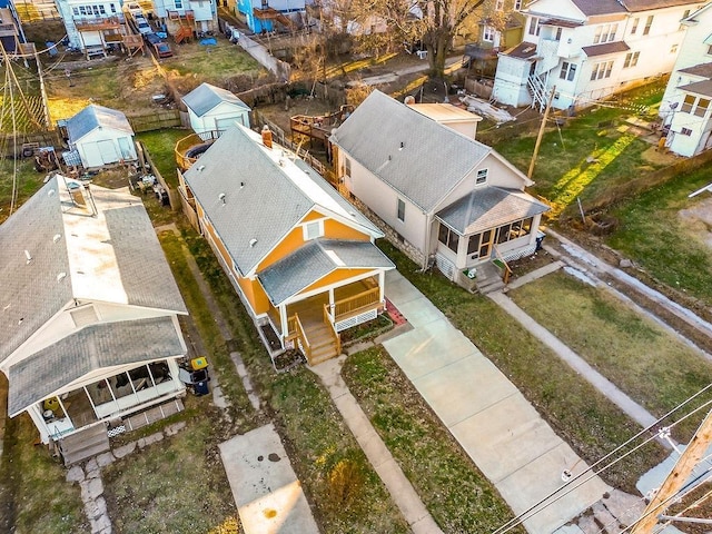 birds eye view of property with a residential view