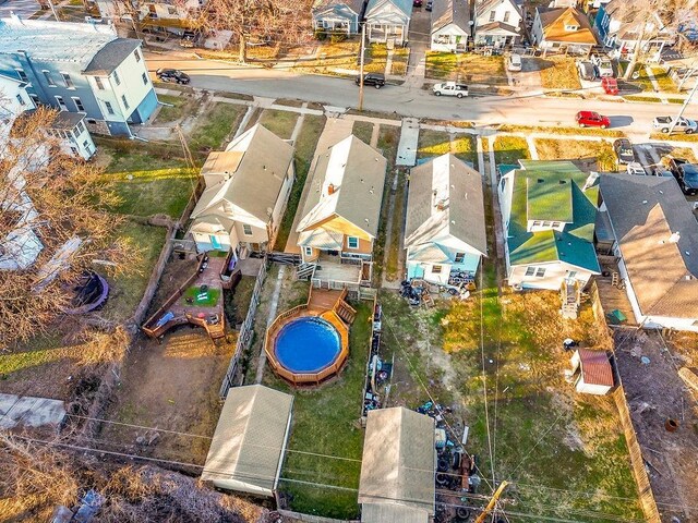 birds eye view of property with a residential view