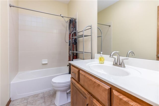 bathroom featuring vanity, tile patterned floors, toilet, and tub / shower combination