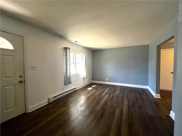 entryway with visible vents, baseboards, baseboard heating, and dark wood-style flooring