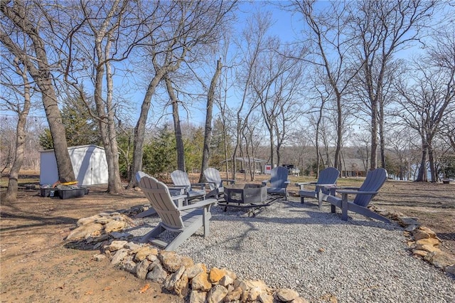 34 Bobcat Dr, Mound City, KS 66056 - view of yard featuring an outdoor fire pit and a shed