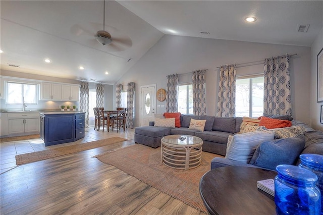 34 Bobcat Dr, Mound City, KS 66056 - living room with a ceiling fan, light wood-style flooring, high vaulted ceiling, and recessed lighting