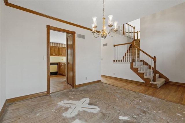 unfurnished living room with visible vents, baseboards, and a chandelier