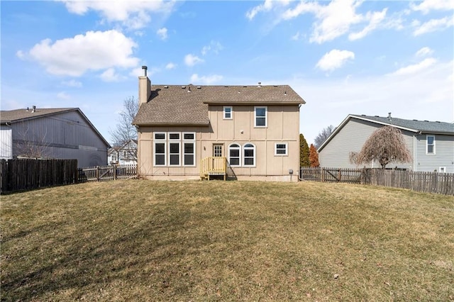 rear view of property with roof with shingles, a lawn, a fenced backyard, and a chimney