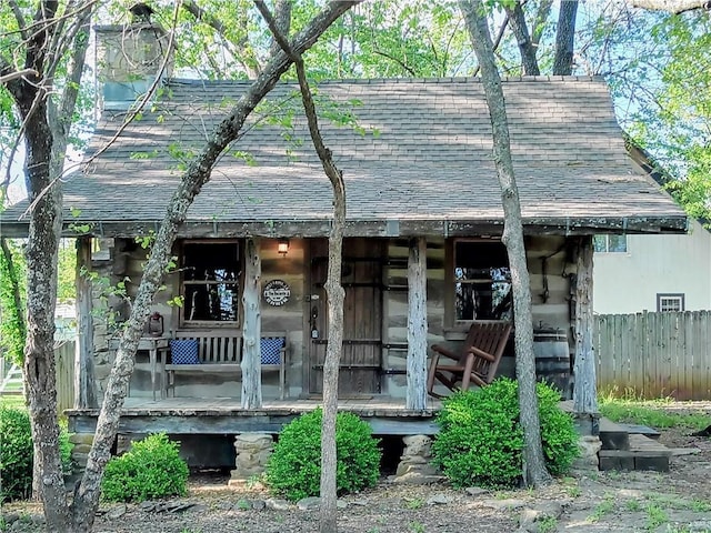 57 Poplar Ln, Linn Valley, KS 66040 - view of front of house with roof with shingles and fence