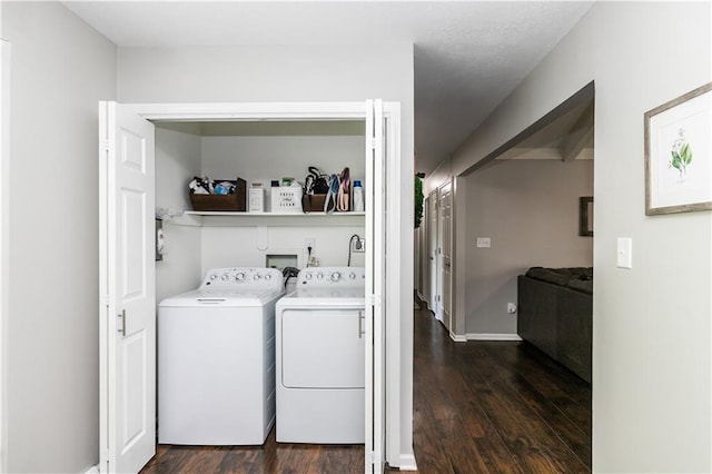 laundry room with laundry area, dark wood-style floors, and washing machine and dryer