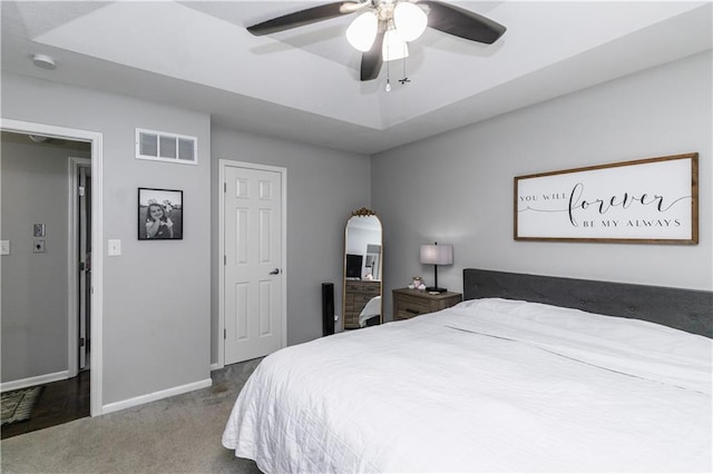 bedroom with arched walkways, carpet, a ceiling fan, baseboards, and visible vents