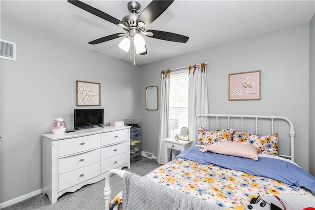 carpeted bedroom featuring baseboards, visible vents, and ceiling fan