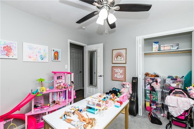 recreation room featuring carpet and ceiling fan
