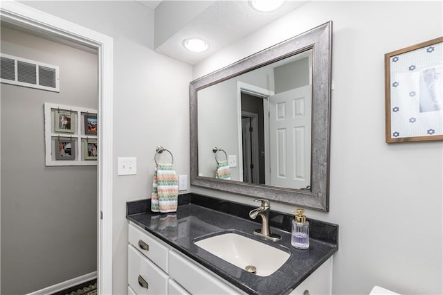 bathroom with vanity and visible vents