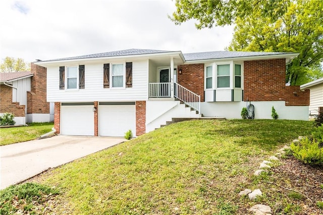 view of front facade with brick siding, a garage, a front lawn, and concrete driveway