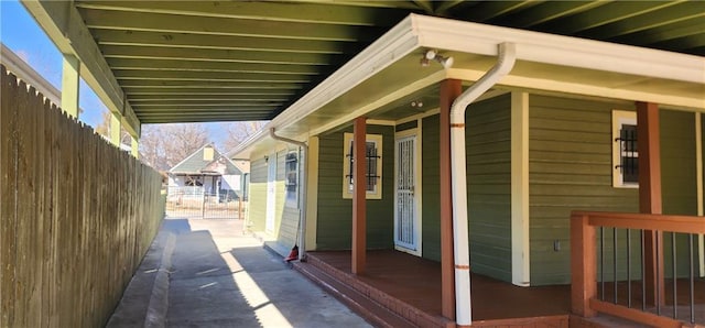 exterior space with a porch and fence