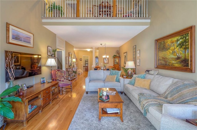 living area featuring a high ceiling and wood finished floors