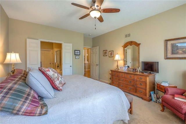 bedroom with visible vents, carpet floors, and a ceiling fan