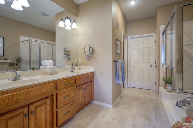 full bathroom with visible vents, a tub to relax in, a stall shower, a sink, and double vanity