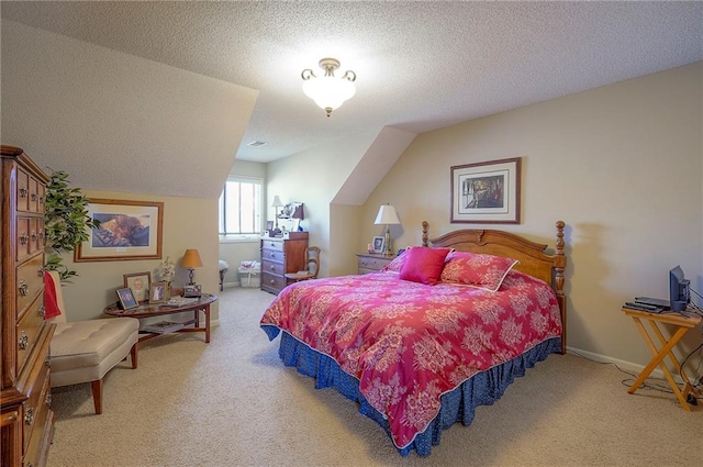 bedroom featuring carpet flooring, a textured ceiling, baseboards, and vaulted ceiling