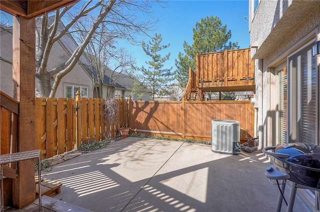 view of patio / terrace featuring central AC and a fenced backyard