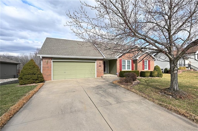 ranch-style house with driveway, a front lawn, an attached garage, a shingled roof, and brick siding