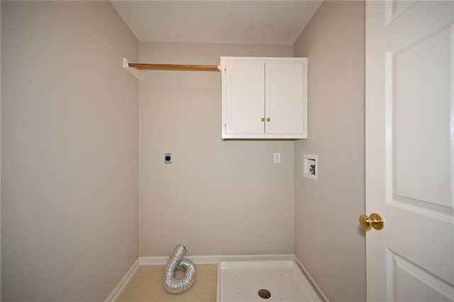 laundry room with baseboards, hookup for a washing machine, cabinet space, hookup for an electric dryer, and a textured ceiling