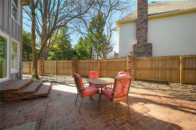 view of patio / terrace with outdoor dining space and a fenced backyard