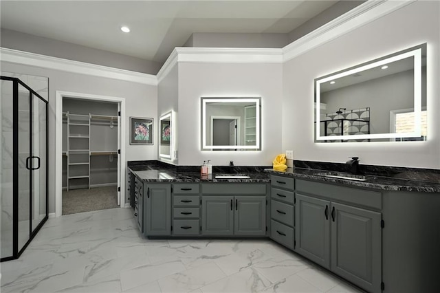 bathroom with marble finish floor, a stall shower, recessed lighting, vanity, and a spacious closet