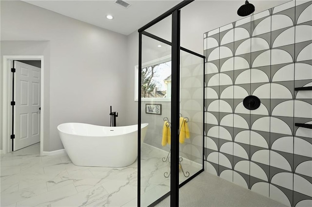 bathroom with a freestanding tub, visible vents, marble finish floor, recessed lighting, and tiled shower