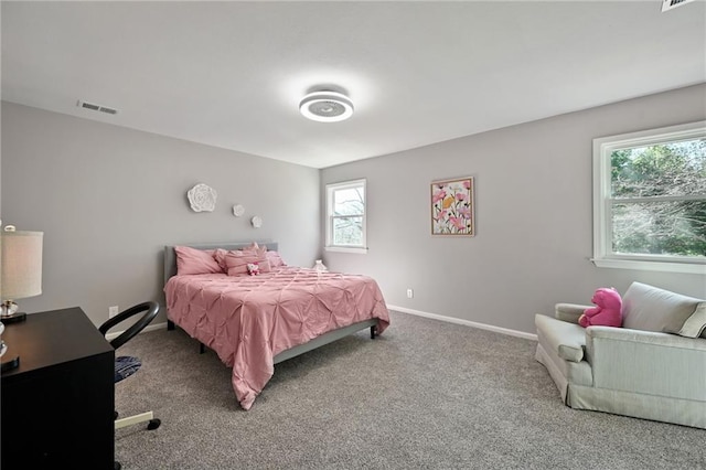 carpeted bedroom with baseboards and visible vents