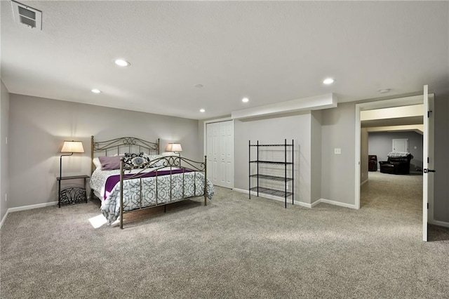 bedroom featuring baseboards, visible vents, and carpet floors