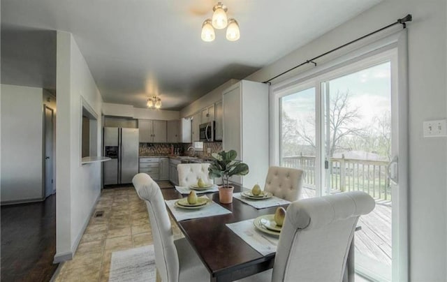 dining space featuring visible vents and baseboards