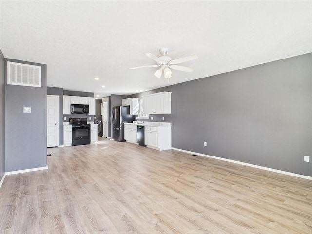 unfurnished living room with visible vents, baseboards, a ceiling fan, and light wood finished floors