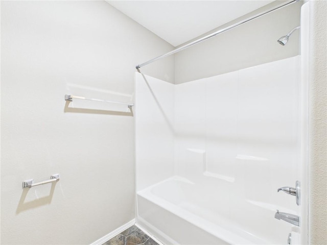 full bath with tub / shower combination and baseboards