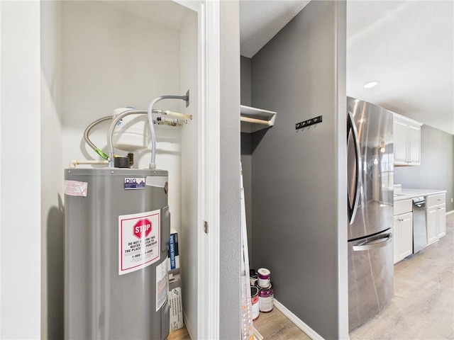 utility room featuring electric water heater