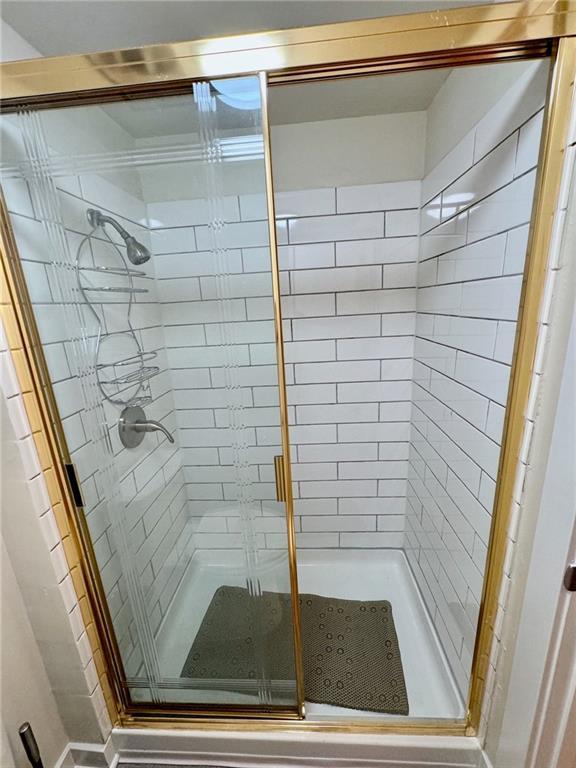 bathroom with a stall shower