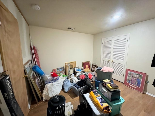 interior space featuring wood finished floors and visible vents