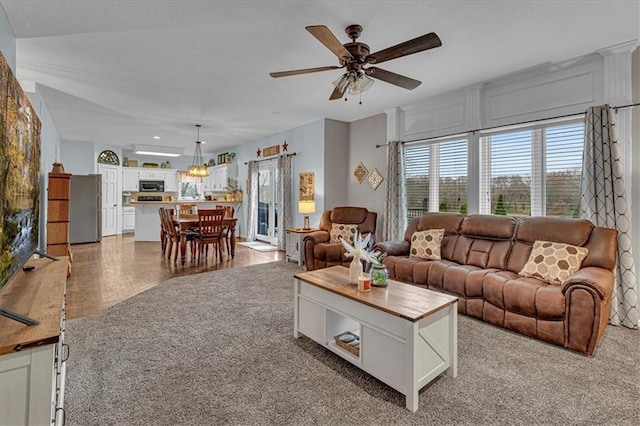 living area featuring a ceiling fan