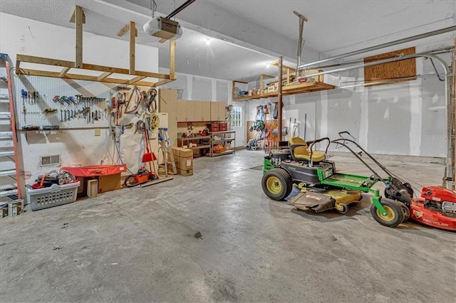 garage featuring a workshop area and a garage door opener