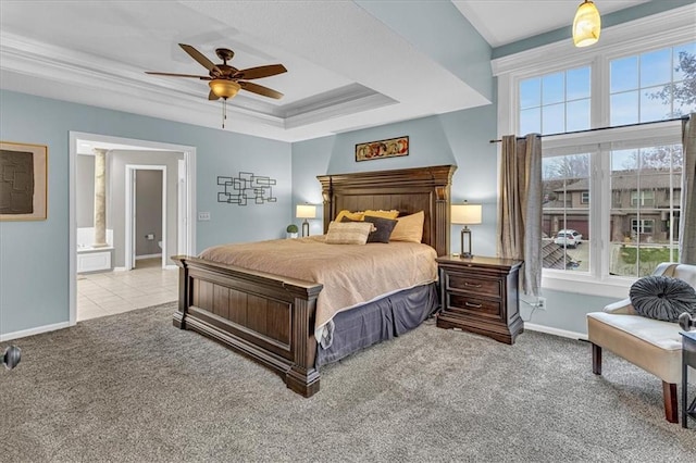 bedroom featuring crown molding, ceiling fan, baseboards, carpet floors, and a raised ceiling