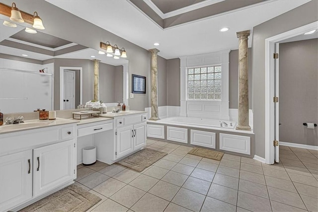 full bath featuring a tray ceiling, double vanity, decorative columns, a sink, and tile patterned floors